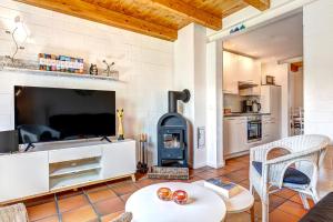a living room with a wood stove at Ferienhaus Odin in Bansin