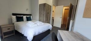 Llit o llits en una habitació de The Arches The Wee Yin