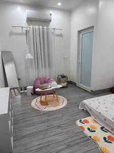 a living room with a couch and a table at Méow Homestays in Ðoan Xá