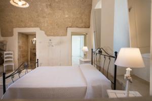 Postel nebo postele na pokoji v ubytování Antica Masseria Ficazzana - Tenuta