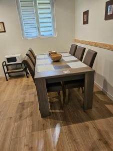 a dining room table with chairs and a bowl on it at Grande Sologne in Clémont +11 photos