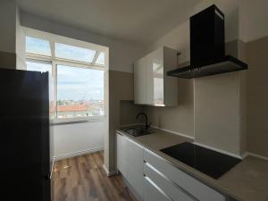 a kitchen with a sink and a window at Amo Venice in Mestre