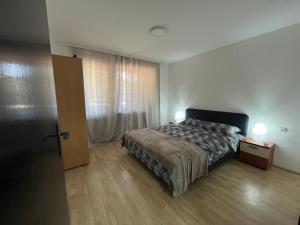 Postel nebo postele na pokoji v ubytování Apartman u srcu apatina