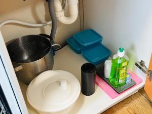 a kitchen counter with a sink and a pot and containers at AyCatcherHomes - Top Lage I 4 Personen I 2 Schlafzimmer I Zentral I Altstadt Marburg I Nähe Fluss Lahn I WLAN I Boutique App CHIRON in Marburg an der Lahn +35 photos