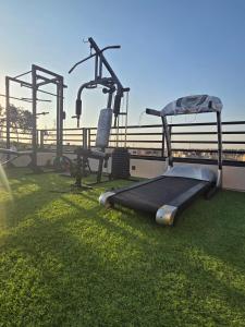 a bed on the grass on top of a building at West Somid Luxury Serviced Apartments in 6th Of October