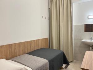 A bed or beds in a room at Hotel Brivio