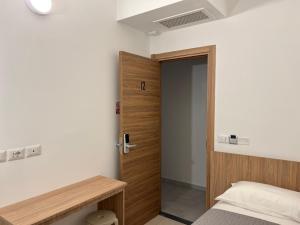 A bed or beds in a room at Hotel Brivio