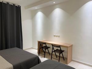 A bed or beds in a room at Hotel Brivio