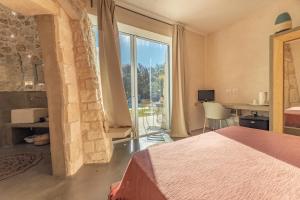 Postel nebo postele na pokoji v ubytování Tenuta Arcàdia
