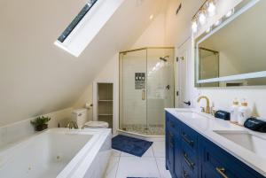 a bathroom with a large tub and a shower at Adventures on Alleghany in McGaheysville +56 photos
