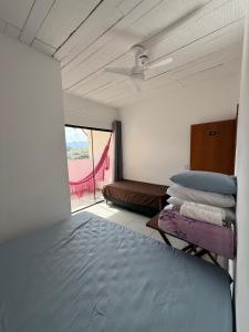 Postel nebo postele na pokoji v ubytování Hostel Amarelinho