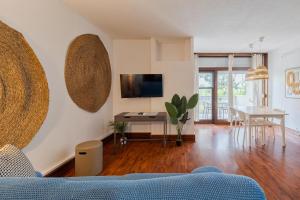 a living room with a couch and a table at Serenity Troia, By Home Match in Troia