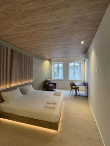 a bedroom with a large bed and a desk at ORM - Santa Teresa Apartments in Porto