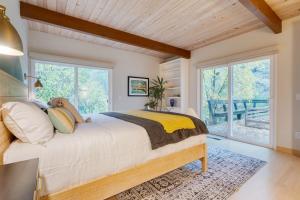 a bedroom with a large bed and large windows at Sonoma Creek Haven in Kenwood