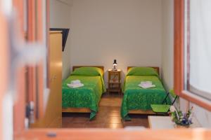 Postel nebo postele na pokoji v ubytování Casa Vittoria