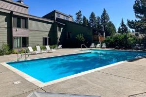 a swimming pool in front of a house at The Summit 276 in Mammoth Lakes