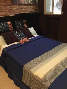 A bed or beds in a room at 44 Centro Apartaments & Suites