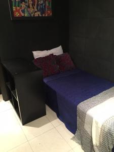 A bed or beds in a room at 44 Centro Apartaments & Suites