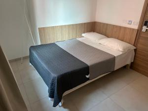 A bed or beds in a room at Hotel Brivio