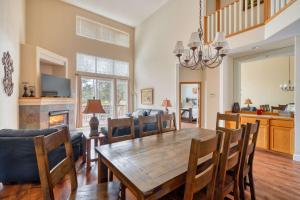 a dining room and living room with a table and chairs at Hot-Tub - 4BDR - Located in Eagle Crest Resort in Redmond +30 photos