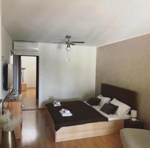 a bedroom with a bed and a ceiling fan at Villa Angel Dalia in Novi Vinodolski