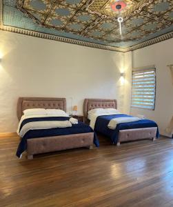 Giường trong phòng chung tại Suite en casa patrimonial