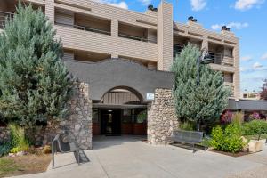 a building with a bench in front of it at The Christie Lodge – All Suite Property Vail Valley/Beaver Creek in Avon