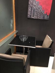 A seating area at 44 Centro Apartaments & Suites