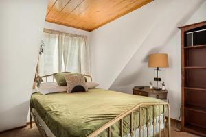 a bedroom with a bed and a window at Pineland Getaway - Serene Escape in Green Valley Lake