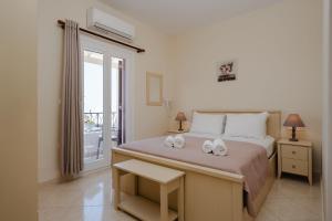 Ένα ή περισσότερα κρεβάτια σε δωμάτιο στο Stella's Villa ' 80sqm Sea View Apartment ' 50m from beach