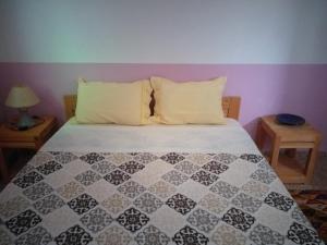 Uma cama ou camas num quarto em Gite Tigmi Azrur