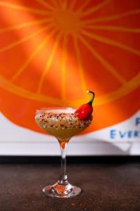 a drink with a chili pepper on top of it at Artist Residence Brighton in Brighton & Hove