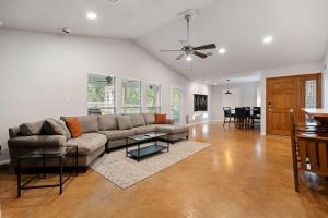 a living room with a couch and a table at 2br Texas Countryside Home w Hot Tub in Marble Falls