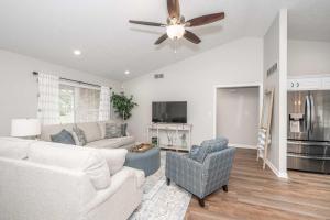 a living room with a couch and a ceiling fan at Crittenden Ark Haven in Crittenden