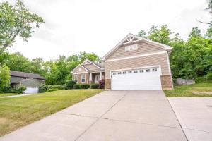 a house with a white garage in a yard at Urban Escape in Cincinnati +48 photos