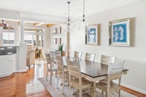 a dining room with a table and chairs at Hidden Paradise - Coastal Views in Ocean View