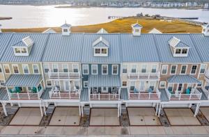 an aerial view of a house with a blue roof at Hidden Paradise - Coastal Views in Ocean View