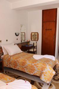 Postel nebo postele na pokoji v ubytování Hotel Sindibad