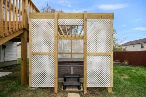 a wooden structure with a chair in a backyard at The Restful Ark in Crittenden