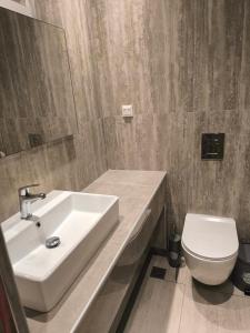 a bathroom with a sink and a toilet at Down Town Skiathos in Skiathos Town