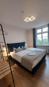 Postel nebo postele na pokoji v ubytování Hotel Kutzbach