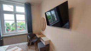 TV a/nebo společenská místnost v ubytování Hotel Kutzbach