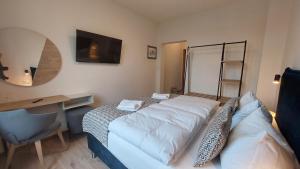 Postel nebo postele na pokoji v ubytování Hotel Kutzbach