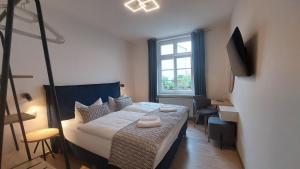 Postel nebo postele na pokoji v ubytování Hotel Kutzbach