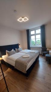 Postel nebo postele na pokoji v ubytování Hotel Kutzbach