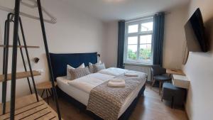 Postel nebo postele na pokoji v ubytování Hotel Kutzbach