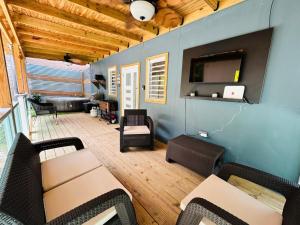 a living room with a couch and a table at Salty Wagon Studio - 4 min from Almendros Beach in Rincon