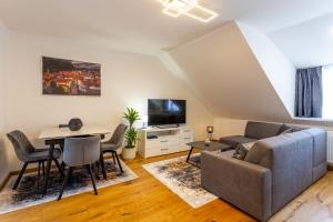 a living room with a couch and a table at Vila Slovenka in Celje