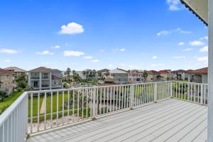 a balcony with a white railing and condos at Beach Access with Elevator & FREE Activities in Gulf Shores
