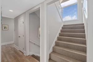 a staircase in a home with a window at Beach Access with Elevator & FREE Activities in Gulf Shores